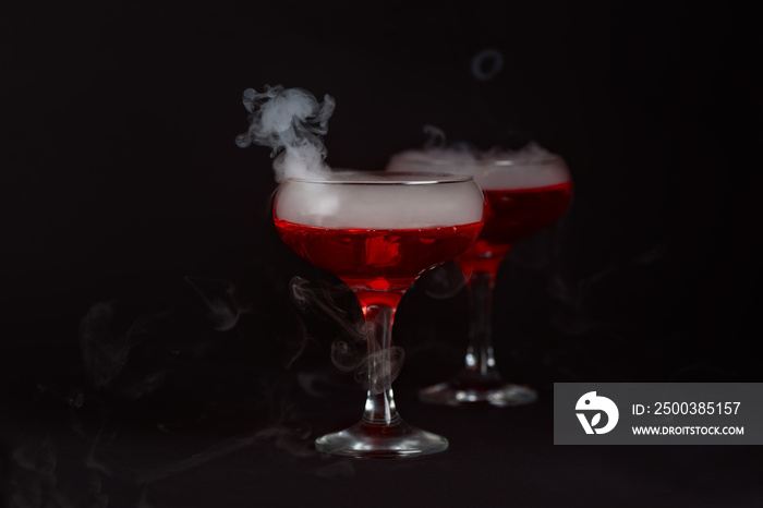 Halloween red cocktail Bloody Mary with smoke