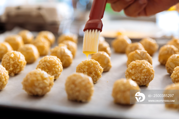 Woman kneading marzipan for make panellets.