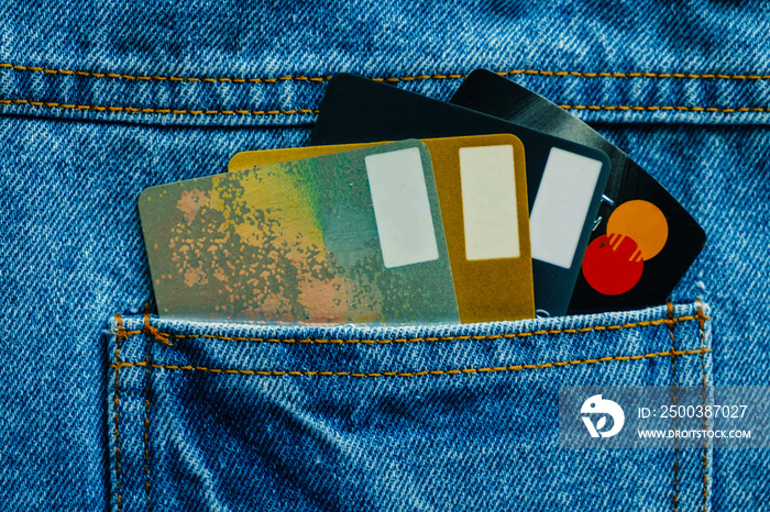 Credit cards in back of pocket blue denim jean for business and finance concept