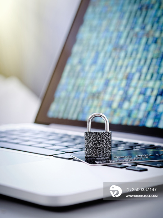 Closeup of a padlock and a payment bank plastic card