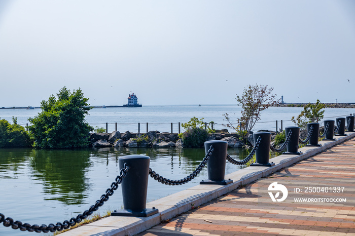 Pier in foreground, Lorain lighthouse in background, Ohio, USA