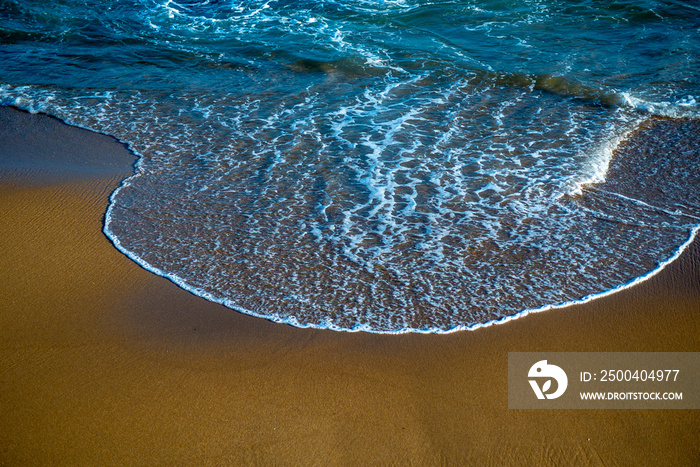 Ocean waves crashing on the beach