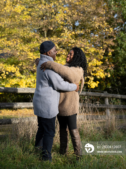 Portrait of couple embracing in nature