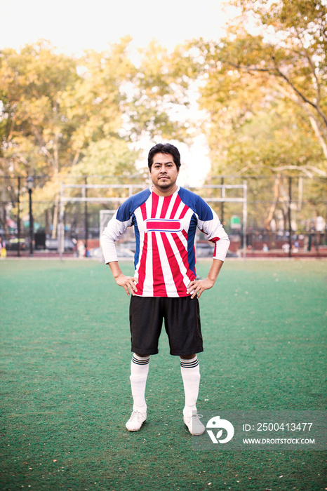 Soccer player standing in soccer field