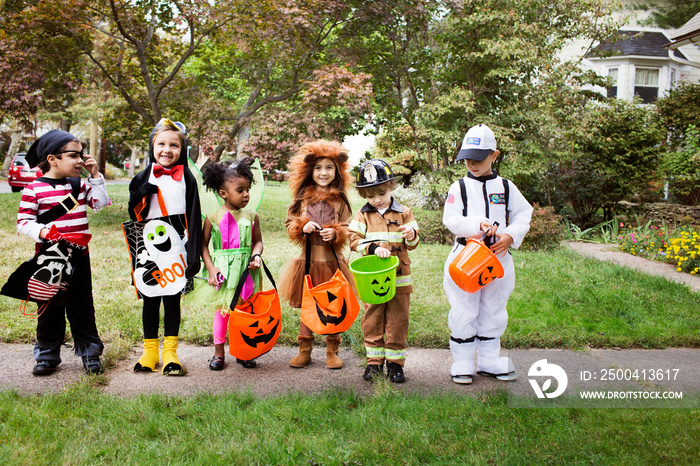 Portrait of children (2-3, 4-5) wearing costumes on halloween