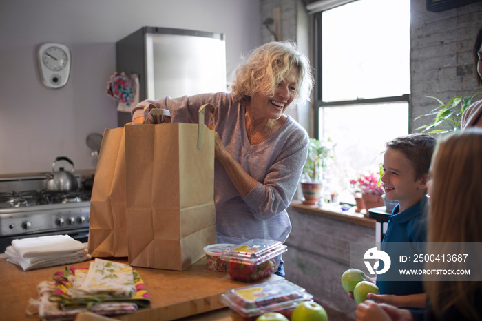 Grandma with her grandchildren in kitchen