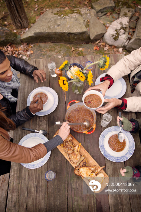 Friends having dinner outdoors