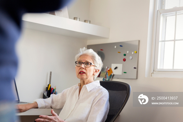 Senior woman talking with her adult son