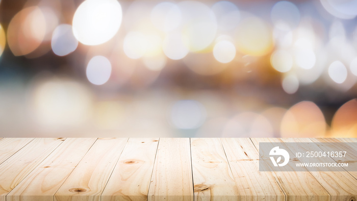 Wood table top on bokeh abstract background and used for montage or display products.