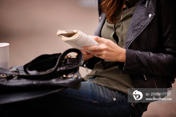 Young woman reading book