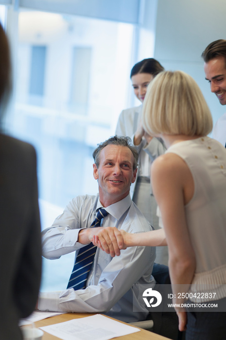 Corporate business people shaking hands in conference room meeting