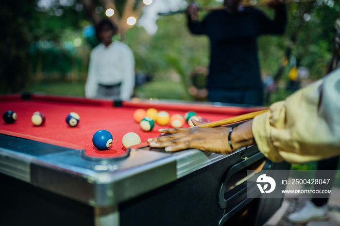 Queer masculine women playing pool