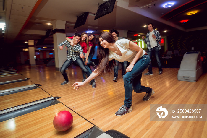 Cheerful friends at the bowling alley