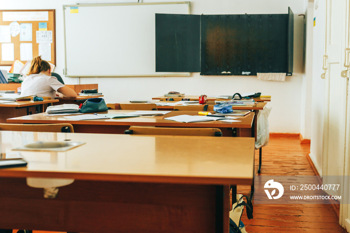 Empty classroom with school supplies, black board