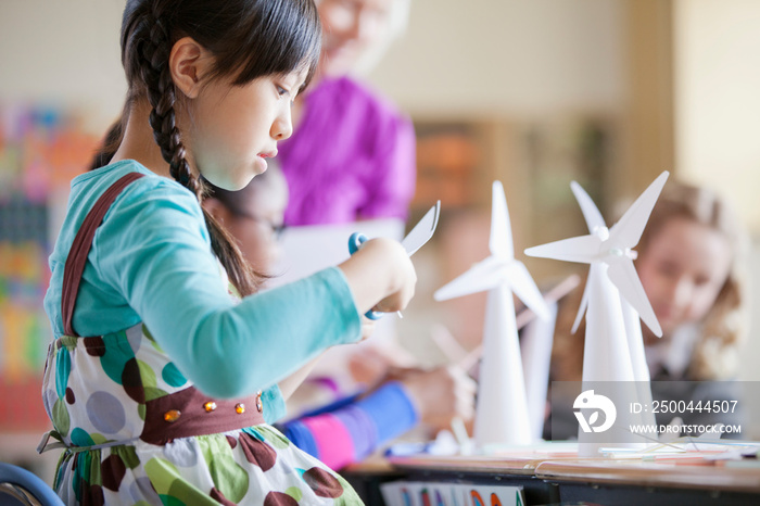 elementary school students building wind turbine models