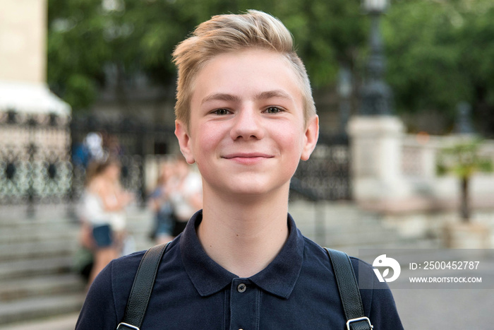 Portrait of a beautiful teenage boy. Close up photo. Young student have fun. Lifestyle photo.