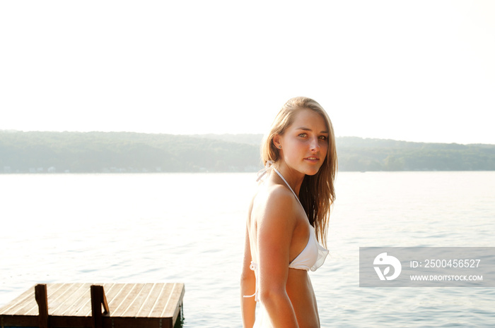 Portrait of woman wearing bikini at lake