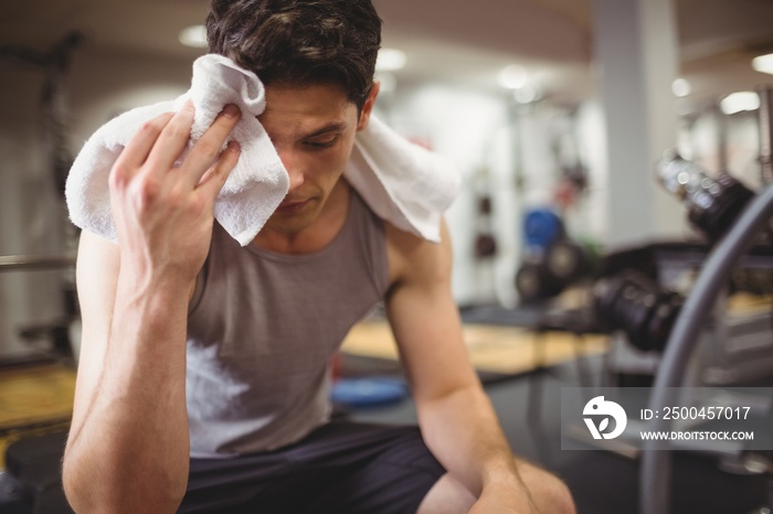 Fit man taking a break from working out