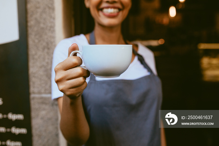 Barista offering a coffee