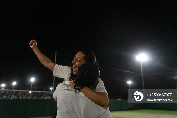 Female soccer players celebrating