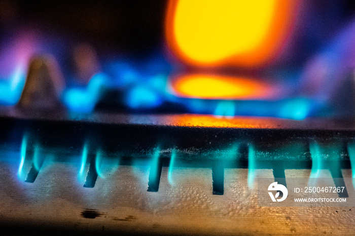 Burning gas stove in a kitchen close up