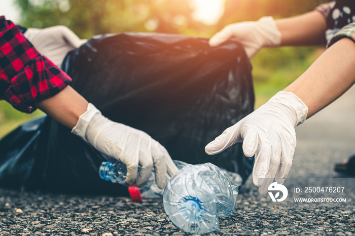 Women volunteer help garbage collection for to recycling environment.