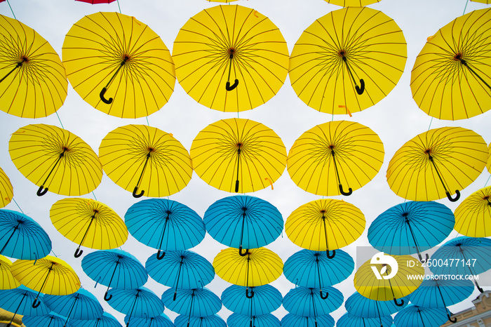 Bright colorful yellow and blue umbrellas background