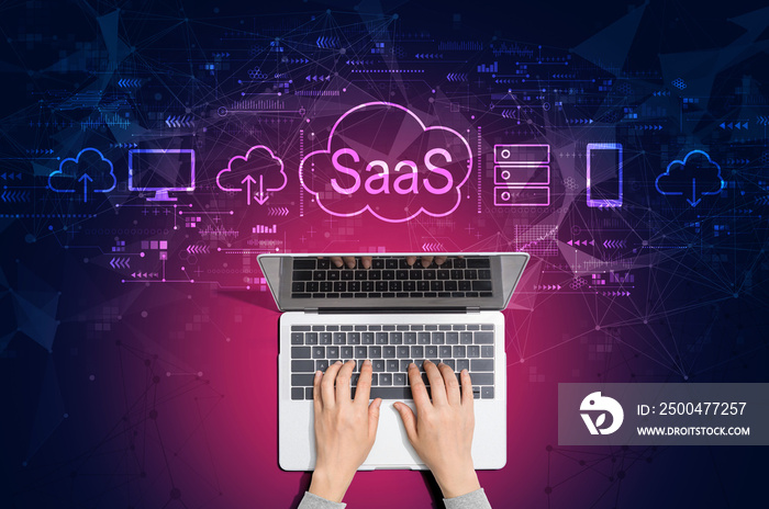 SaaS - software as a service concept with person using a laptop computer