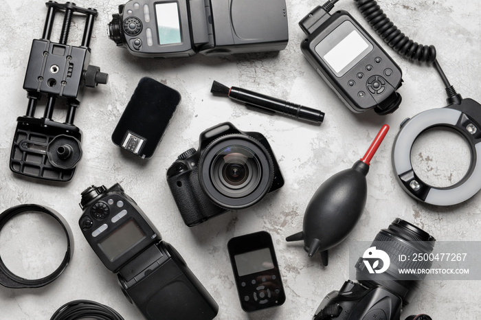 Modern photographers equipment on grey background