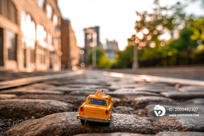 Classical taxi model car parked on an old street in Brooklyn near Brooklyn bridge.