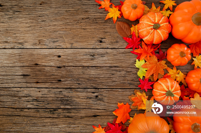 Autumn leaves on wooden background