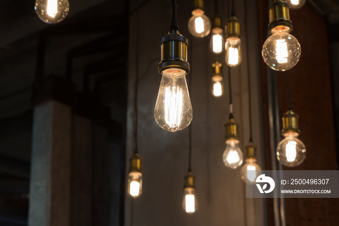 vintage light bulbs hanging from ceiling for decoration in living room. loft decoration style.