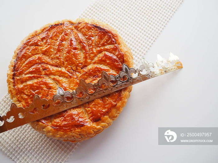 Homemade Epiphany cake or Twelfth Night cake (french galette des rois) made of puff pastry and frang