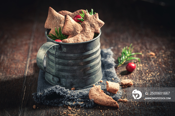 Traditionally gingerbread cookies for Christmas in rustic mug