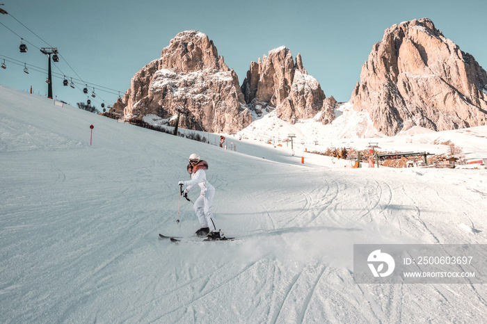 Woman skiing in high mountains.