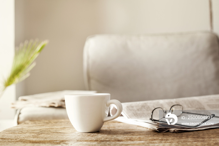 Newspapers with eyeglasses and coffee