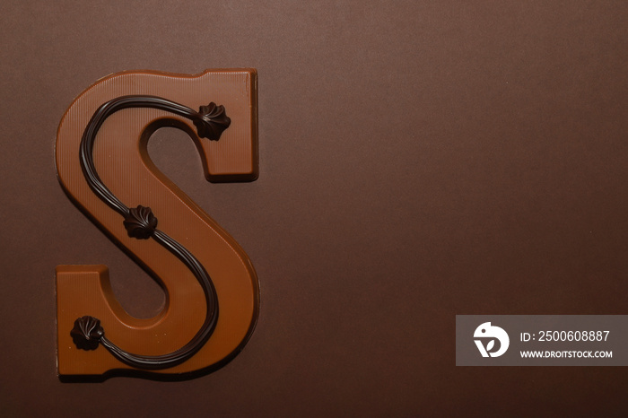 Milk chocolate letter S. Symbol of Dutch feast called Sinterklaas.