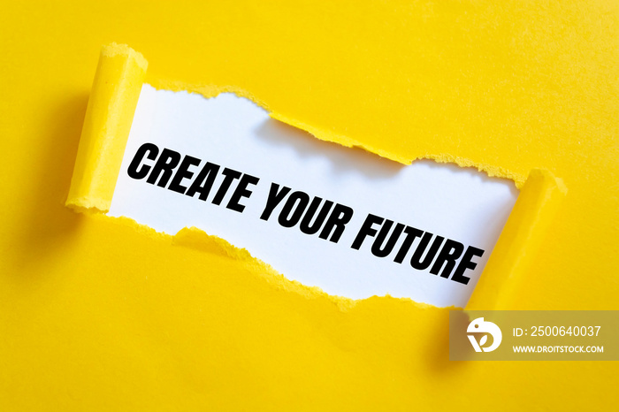 Torn yellow paper on white surface with Create your future words.