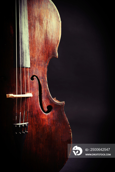 Vintage cello on dark background