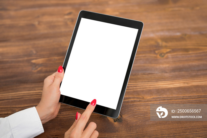 Person using tablet with empty blank screen, vertical orientation