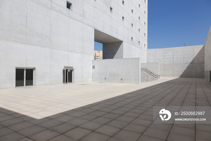 Sunny concrete building courtyard