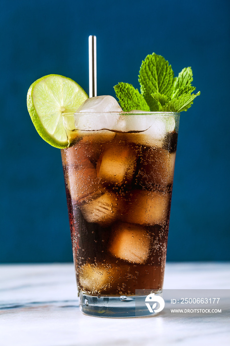 Coca Coke cocktail in a tall glass cuba libre. refreshing summer drink