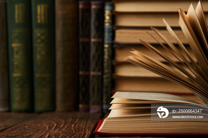 Stack of books on bookshelf, close-up. Education learning concep