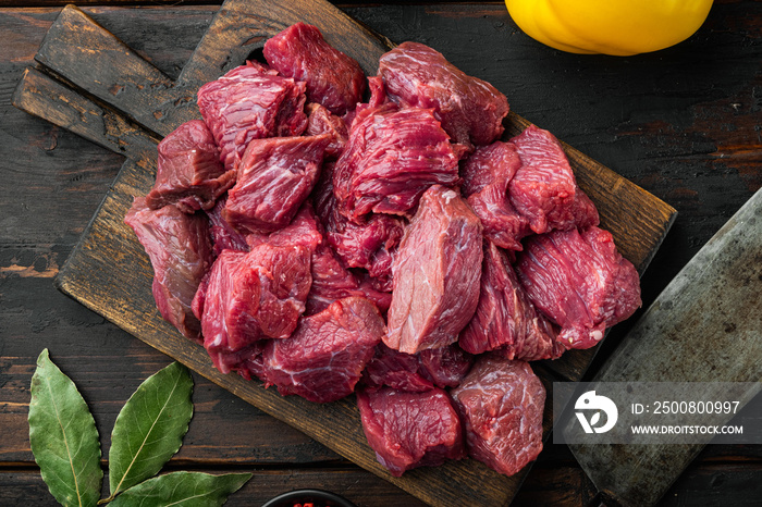 Raw organic meat  beef or lamb with sweet bell pepper, on old dark  wooden table , top view flat lay