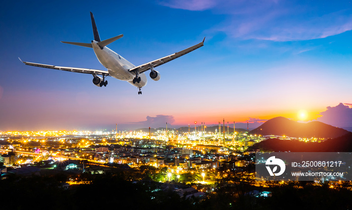 Airplane for transportation flying over the night scene city on sunset background. Travel transportation concept.