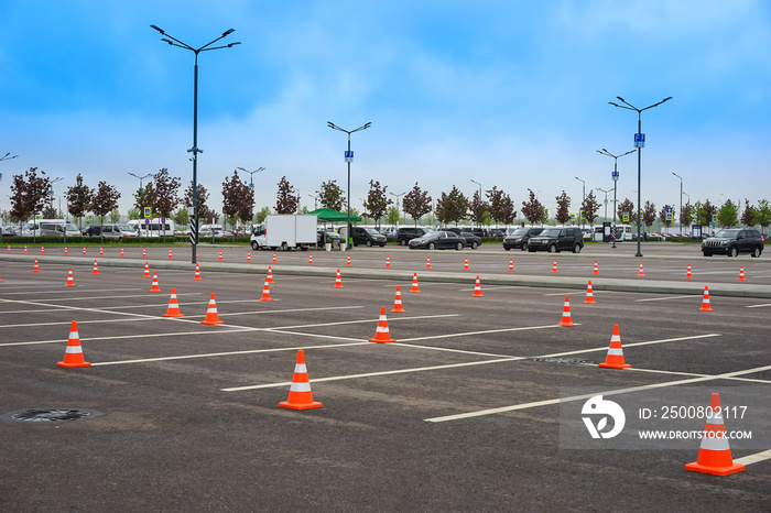 Parking space. Open parking for cars. Signal road cones.