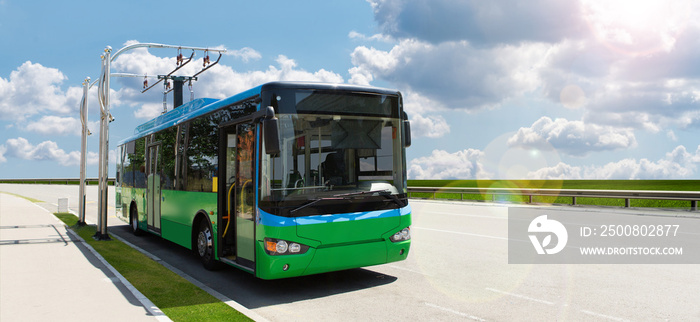 Electric bus at a stop is charged by pantograph