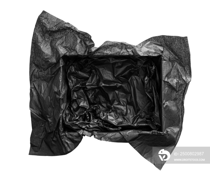 Top view of empty open gift box with black color silk paper filling inside. Luxury present wrapping or products background. Isolated on white, studio shot.