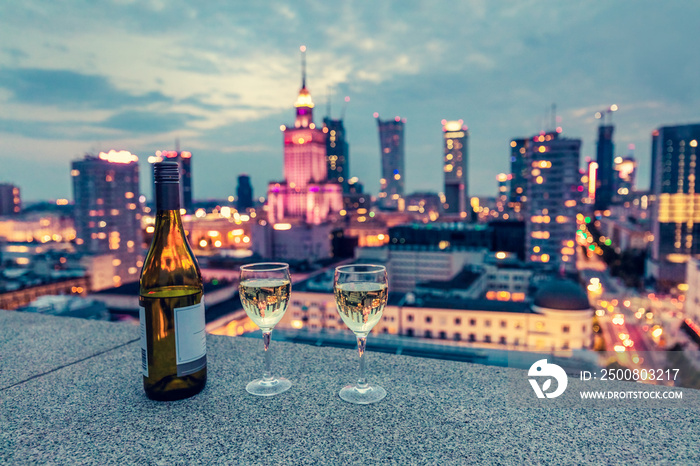 Wine with view on Warsaw, Poland at night