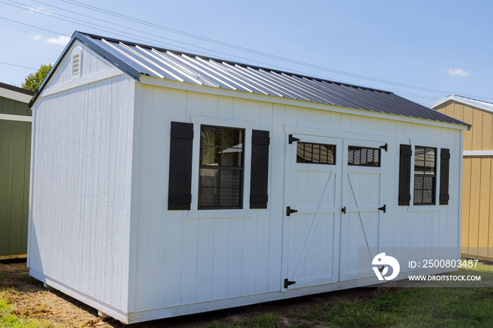 Wooden shed for storing gardening tools is perfect place to store them